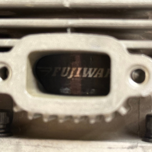 Extreme close-up of the Fujiwara branding on the intake manifold of the HPRC 38cc race ported Fujiwara engine