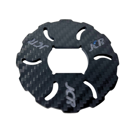 Carbon fiber texture disc with 'JCR' branding on a white background