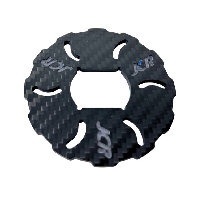 Carbon fiber texture disc with 'JCR' branding on a white background