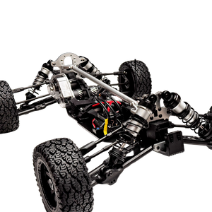 Close-up of a mechanical vehicle chassis with visible suspension and tires on a white background