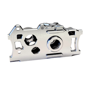 Metallic engine valve cover on a white background