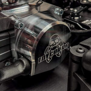 Metallic engine cover with 'Taylor RC' logo on a motorcycle