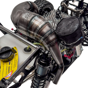 Close-up of a detailed model engine with visible branding on a white background