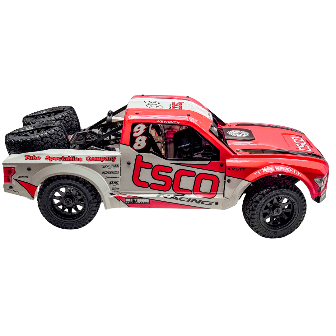 Red and gray toy truck with 'tsco racing' branding on a white background