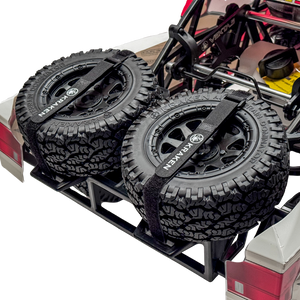 Close-up of RC car tires with a black tire carrier on a white background