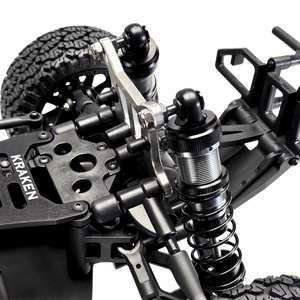 Close-up of a Kraken RC car chassis with suspension and wheel setup on a white background
