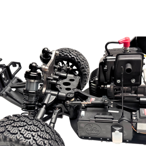 Close-up of a detailed model car chassis with visible components on a white background