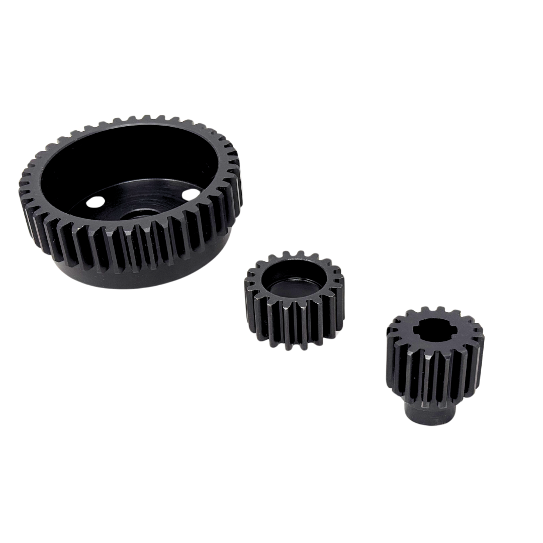 Three black metal gears of different sizes on a white background