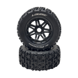 Two black off-road tires with tread patterns on a white background