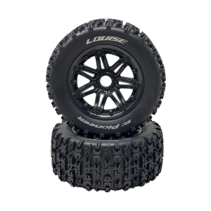 Two black off-road tires with tread patterns on a white background