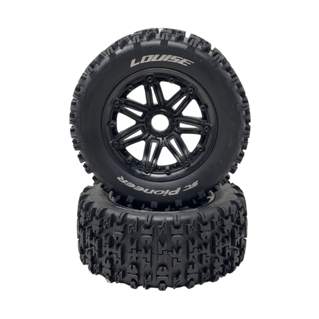 Two black off-road tires with tread patterns on a white background