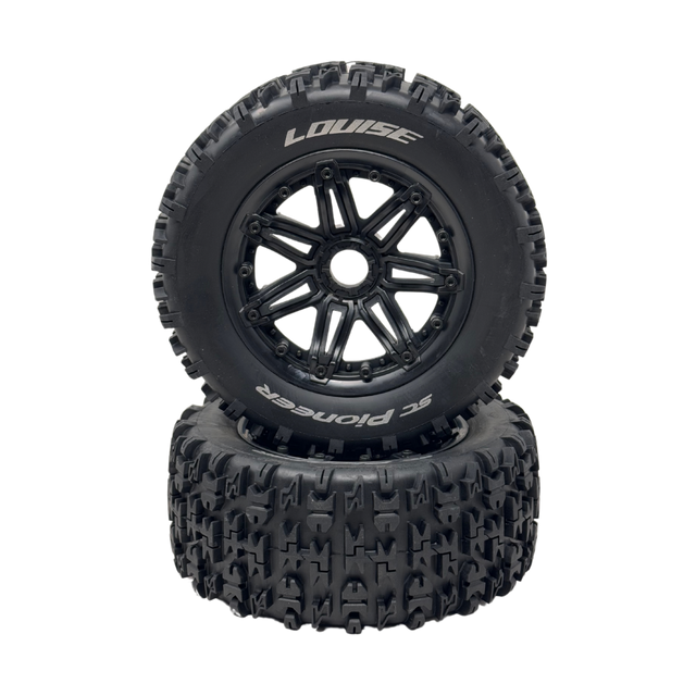 Two black off-road tires with tread patterns on a white background