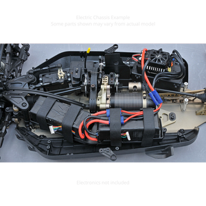 Close-up of an RC car chassis with wiring and components on a gray background
