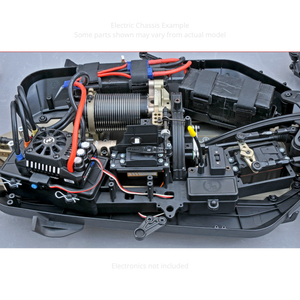 Close-up of a mechanical model with intricate components and wiring on a gray background.