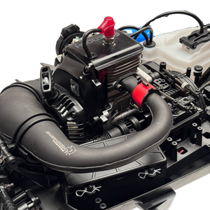 Close-up of a model engine with visible branding on a white background