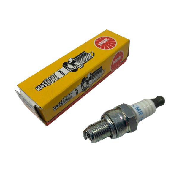 Spark plug and its packaging with a visible brand logo on a white background