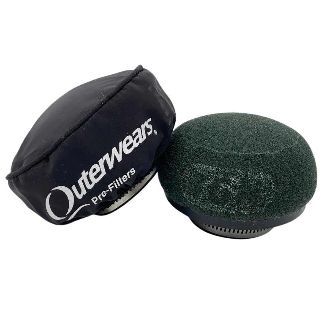 Black Outerwears pre-filter and green foam filter on a white background