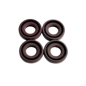 Four brown rubber washers on a white background