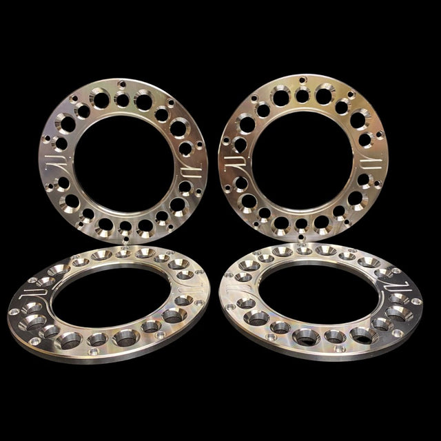 A set of four metal beadlocks designed for 1/5 scale wheels and tyres, displayed on a dark background.