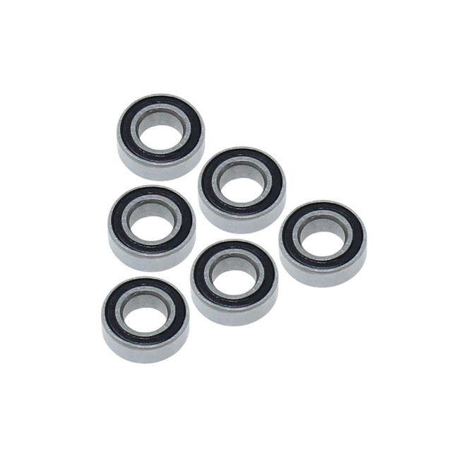 Six metal bearings arranged in two rows on a white background