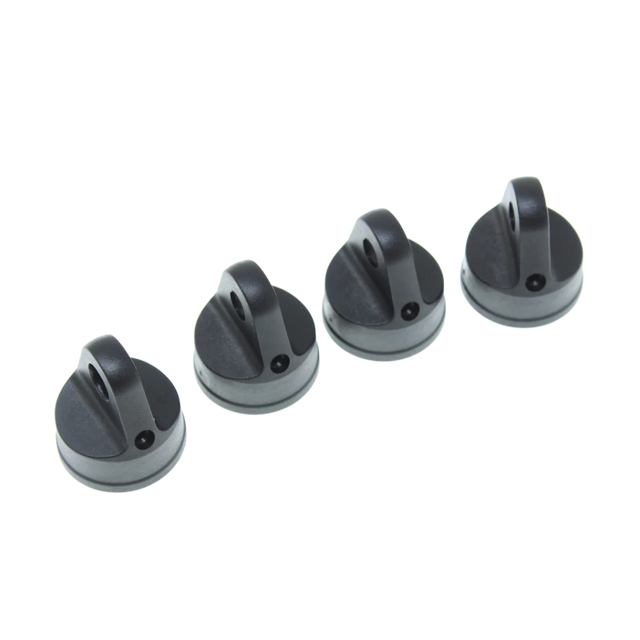 Four black caps on a white background