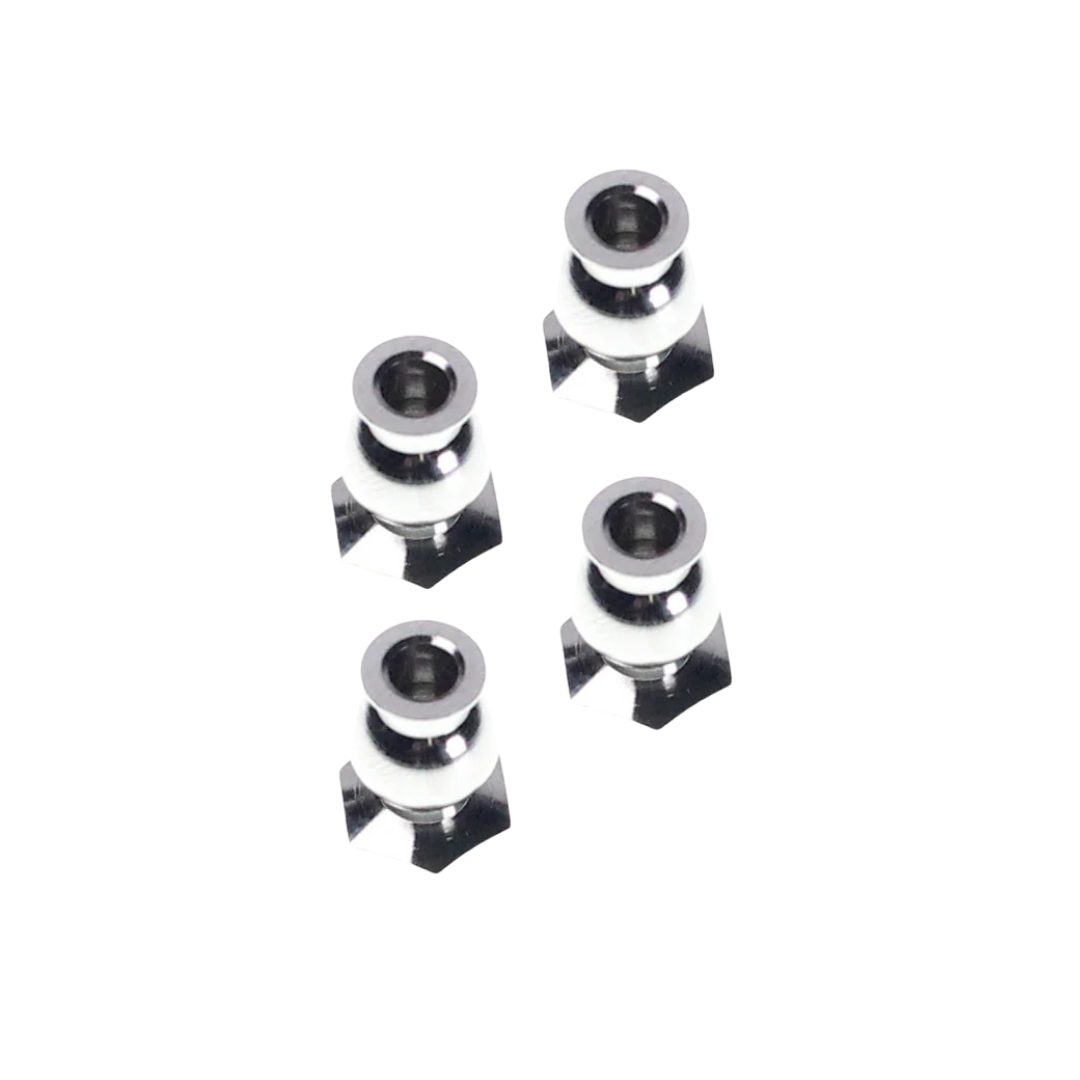 four metallic star-shaped objects on a white background