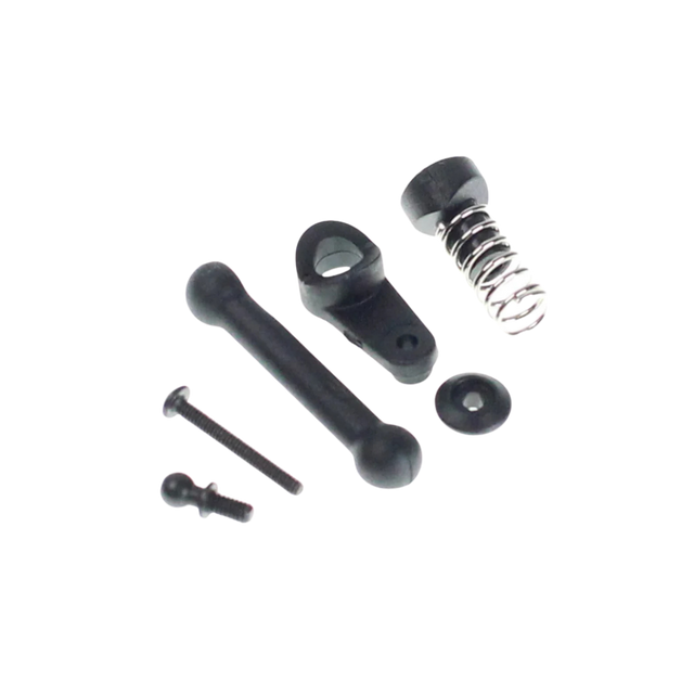Mechanical parts including a spring, shafts, and bearings on a white background