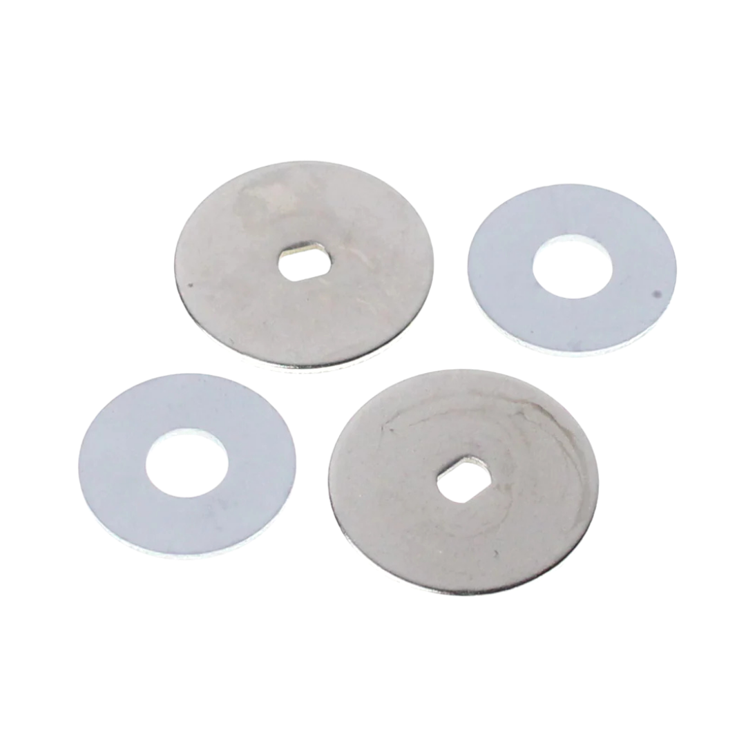 Four circular metal washers on a white background