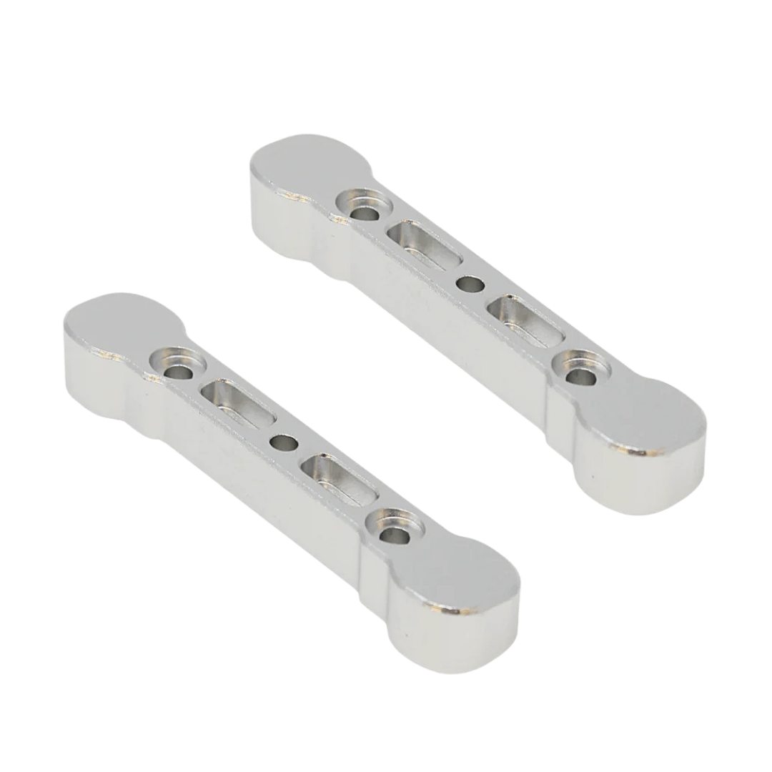 Two metallic metal brackets on a white background