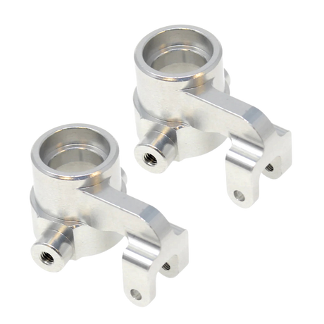 Two metallic metal suspension links on a white background
