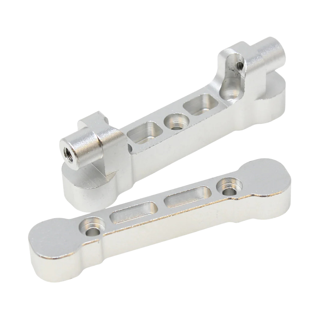 Two metallic metal brackets on a white background