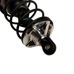 Taylor Losi 5IVE-T 3.0 raw silver billet shock perch fitted to a black shock with spring, angled view showing the grub screw and shock end