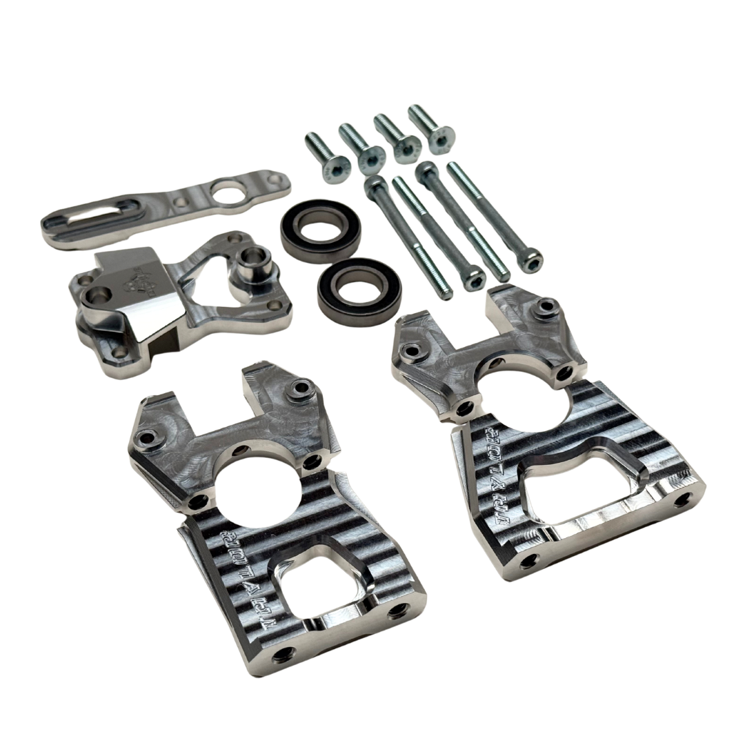 Taylor Losi 5ive-TG 3.0 centre diff mount kit contents from above, with machined black anodised mount halves, raw silver parts and fixings