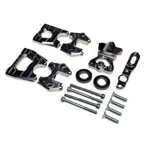 Taylor Losi 5ive-TG 3.0 centre diff mount kit components at an angle, showing ribbed black anodised halves, raw silver top plate, bearings and hardware