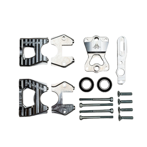 Taylor Losi 5ive-TG 3.0 centre diff mount kit parts laid flat, with raw silver billet caps, top plate, lever, bearings and screws