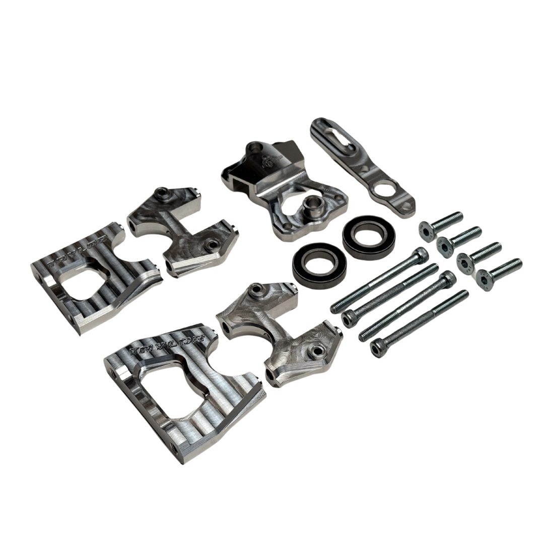 Taylor Losi 5ive-TG 3.0 billet centre diff mount kit contents, including mount halves, rapid removal plate, lever, two bearings, cap screws and countersunk screws