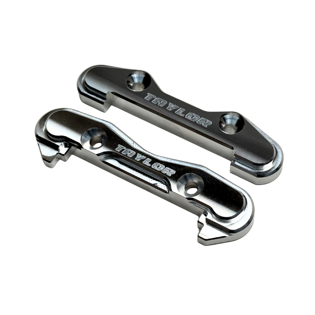 Taylor Losi 5T, 5IVE 2.0 and 5IVE-TG 3.0 raw silver billet 7075 front hinge pin braces, pair showing the engraved Taylor logo and countersunk screw holes