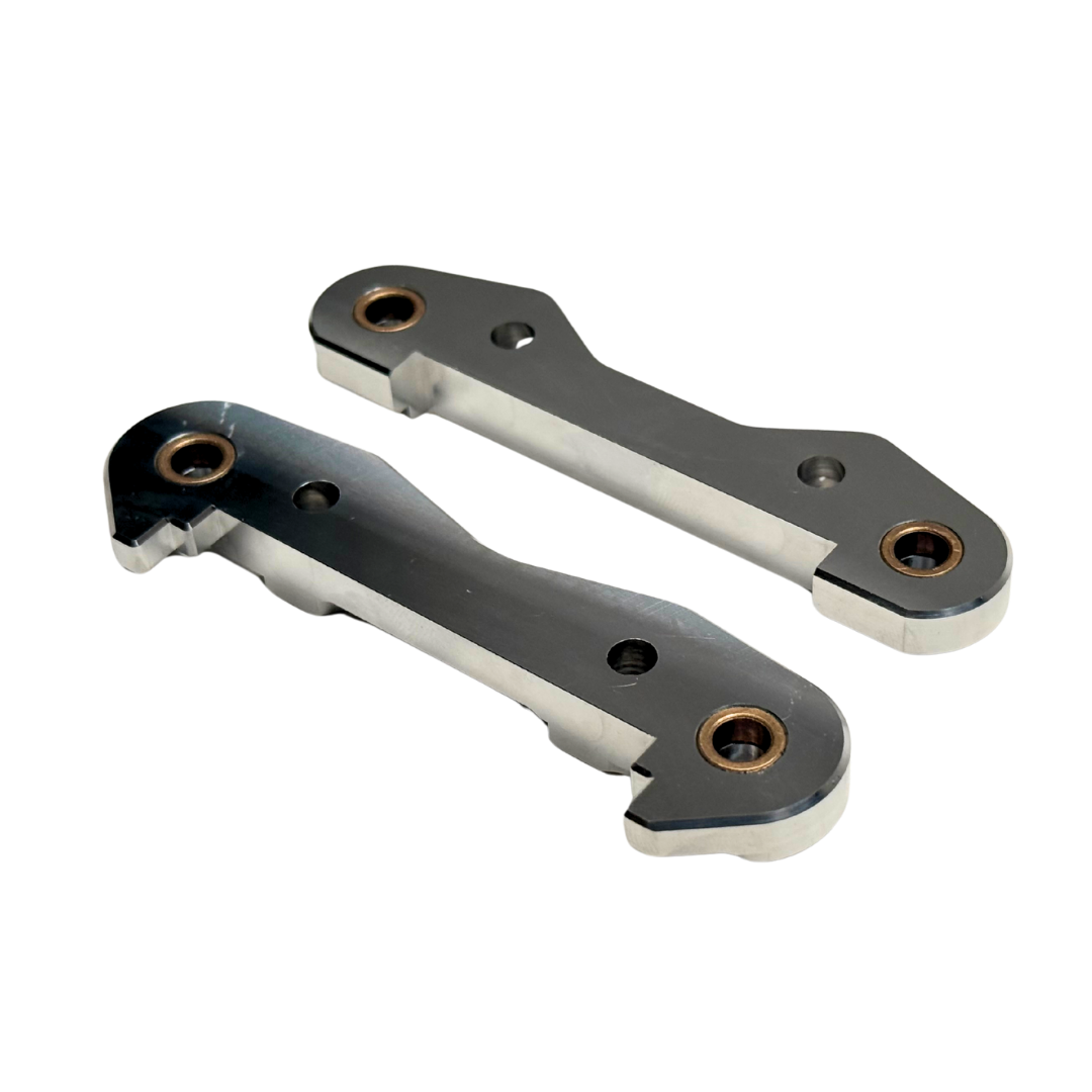 Taylor Losi 5T, 5IVE 2.0 and 5IVE-TG 3.0 raw silver billet 7075 front hinge pin braces, underside view showing the bronze bushings and screw holes