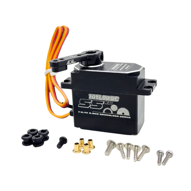 Toy servo motor with wiring and accessories on a white background