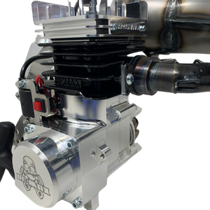 Close-up of a metallic engine with visible branding on a white background