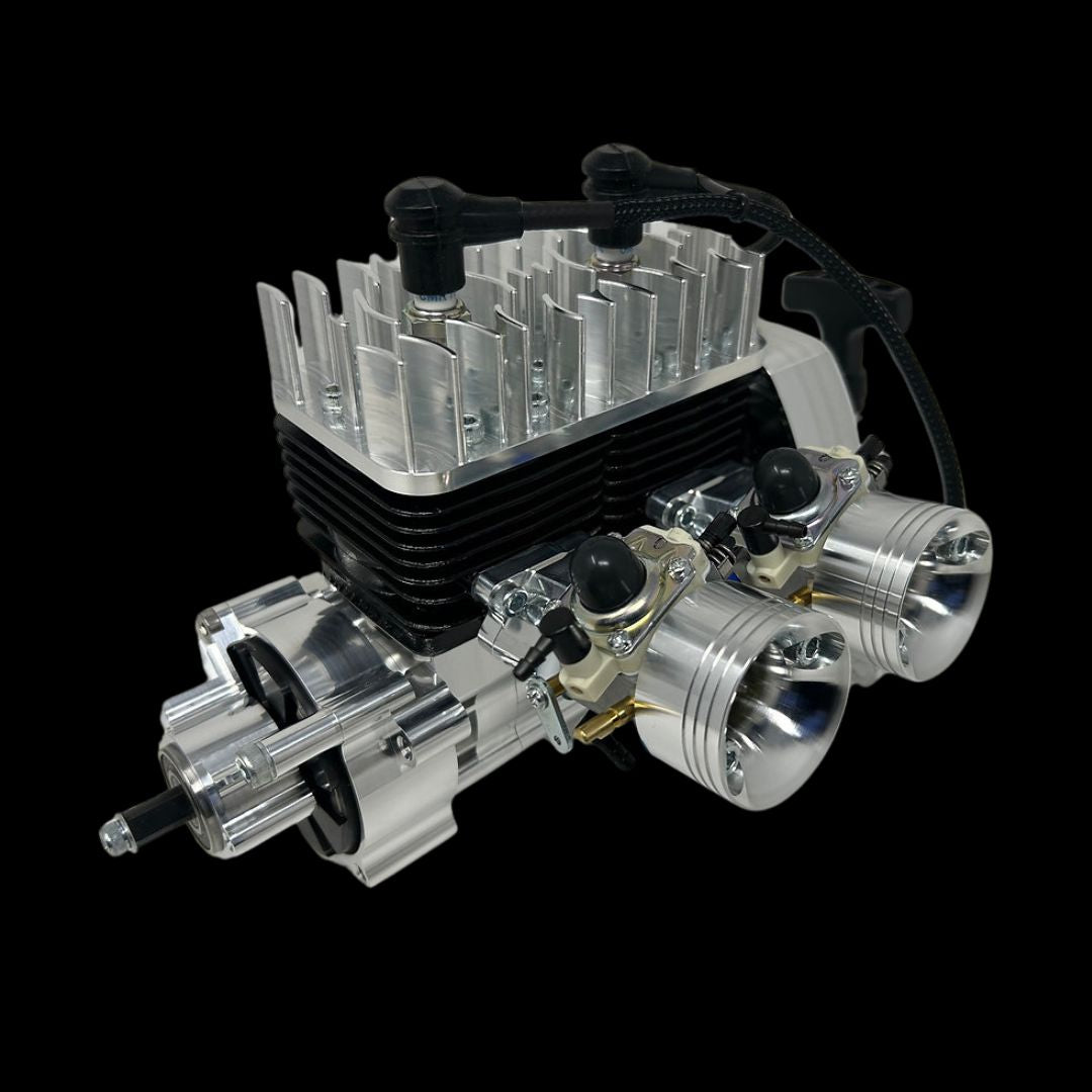 A 70cc billet twin cylinder engine for remote control vehicles, showing the engine block, cylinders, and valve system.