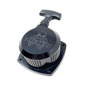 Black metal component with skull design on a white background