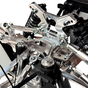 Taylor RC Complete Outlaw V4 Billet Hybrid Slider, close-up of the front shock towers, shocks, and steering linkage