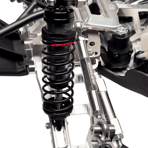 Close-up of a suspension system on a vehicle with a clear background