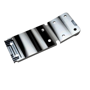 Taylor RC OUTLAW V4 front chassis insert in raw silver, angled view of the counterbored top face showing the mounting holes and ribbed sections