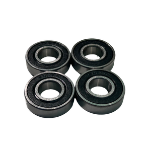 Four black bearings on a white background
