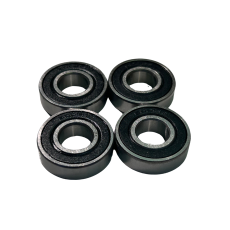 Four black bearings on a white background