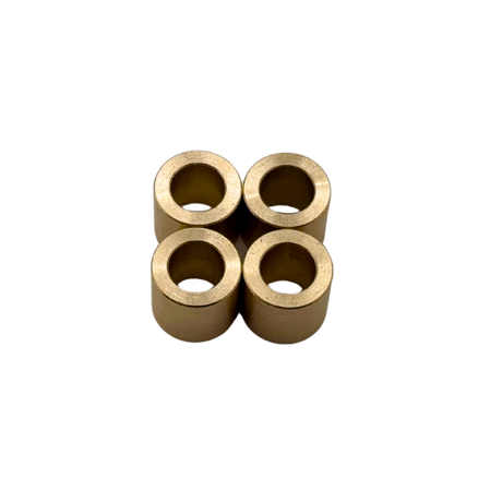 Four brass bushings on a white background