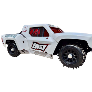 White off-road toy truck with black tires on a white background