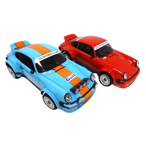Two model cars, one blue and orange with Gulf livery, and one red with Porsche branding, on a white background.